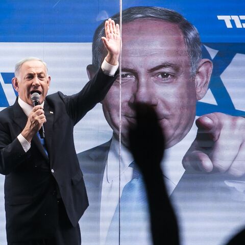 Former Israeli Prime Minister Benjamin Netanyahu speaks to supporters through inside a modified truck with a side bulletproof glass during a campaign event on Oct. 29, 2022 in Bnei Brak, Israel. 