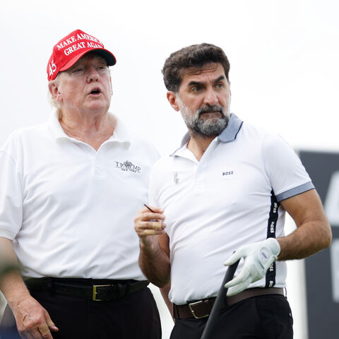 BEDMINSTER, NEW JERSEY - JULY 28: Former U.S. President Donald Trump and Yasir al-Rumayyan, head of the sovereign wealth fund of Saudi Arabia, look on from the second tee during the pro-am prior to the LIV Golf Invitational - Bedminster at Trump National Golf Club Bedminster on July 28, 2022 in Bedminster, New Jersey. (Photo by Cliff Hawkins/Getty Images)