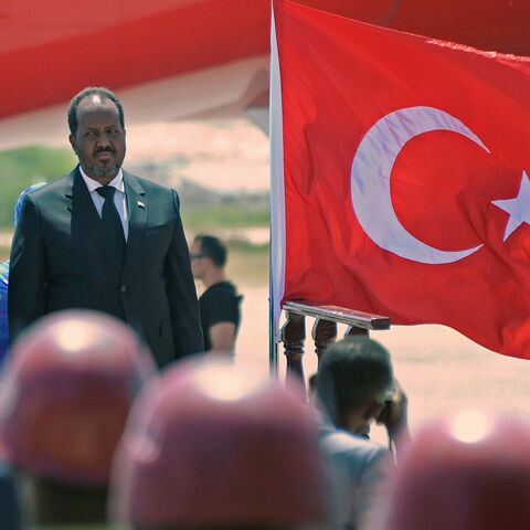 Turkish President Recep Tayyip Erdogan ( L) stands beside Somali President Hassan Sheikh Mohamud upon his arrival at the Aden Abdulle international airport in Mogadishu on Jan. 25, 2015.