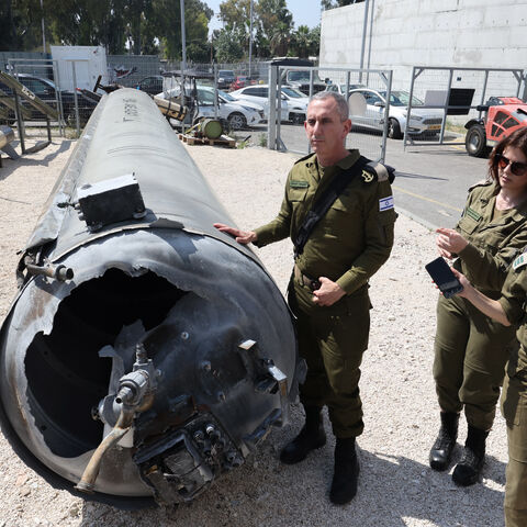 Members of the Israeli military show an Iranian ballistic missile which fell in Israel on the weekend, during a media tour at the Julis military base near the southern Israeli city of Kiryat Malachi on April 16, 2024. Iran carried out an unprecedented direct attack on Israel overnight April 13-14, using more than 300 drones, cruise missiles and ballistic missiles, in retaliation for a deadly April 1 air strike on the Iranian consulate in Damascus. Nearly all were intercepted, according to the Israeli army. 