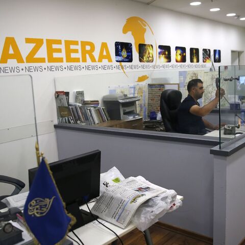 An employee of the Qatar-based news network and TV channel Al Jazeera is seen at the channel's Jerusalem office on July 31, 2017. 