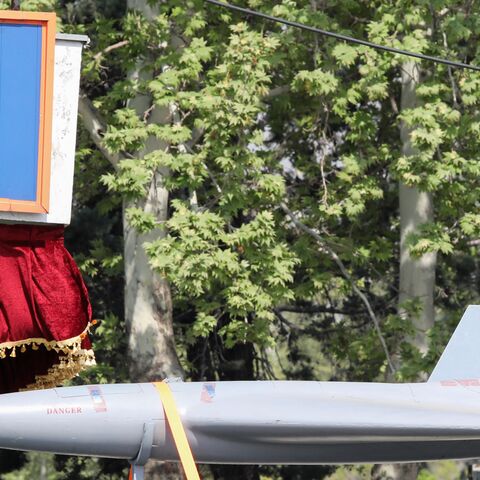 A military truck carries an Arash drone past a portrait of Iranian supreme leader Ayatollah Ali Khamenei during a military parade as part of a ceremony marking the country's annual army day in Tehran, on April 17, 2024. 