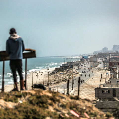 Youths gather atop an elevated area in al-Zahra in the central Gaza Strip on April 23, 2024 amid the ongoing conflict in the Palestinian territory between Israel and the militant group Hamas.