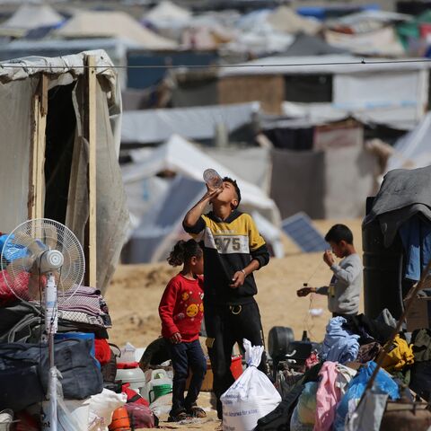 Displaced Palestinians gather their belongings before fleeing al-Mawasi to a safer area in Rafah in the southern Gaza Strip on May 9, 2024, amid the ongoing conflict between Israel and militants from the Hamas movement. 