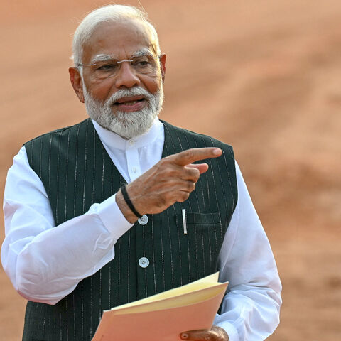 India's Prime Minister Narendra Modi gestures before his speech as he holds a letter by President Droupadi Murmu (not pictured) requesting him to form the country's new government, at the presidential palace Rashtrapati Bhavan in New Delhi on June 7, 2024. 