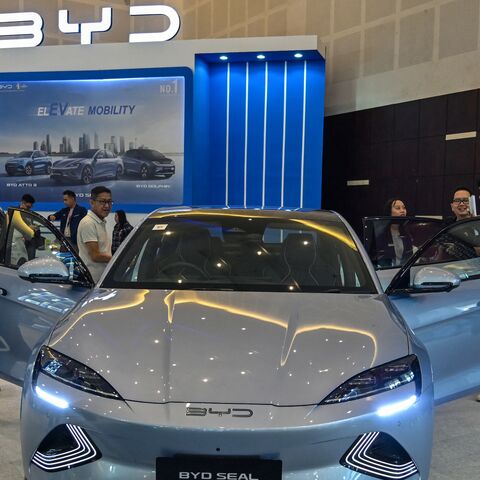 People visit the booth of Chinese automobile manufacturer BYD during the Indonesia International Motor Show in Surabaya on May 29, 2024. 