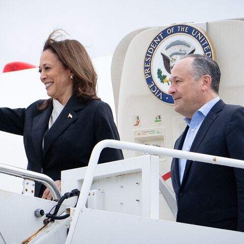 US Vice President Kamala Harris and second gentleman Douglas Emhoff descend from Air Force Two at Delaware National Air Guard base in New Castle, Delaware, on July 22, 2024.