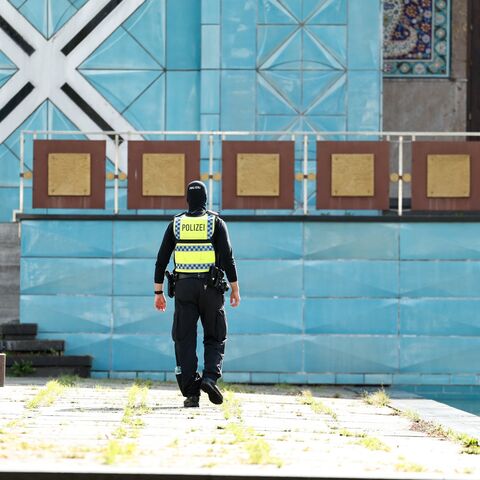 A police officer is seen in front of the Blue Mosque, housing the Islamic Centre of Hamburg, northern Germany, on July 24, 2024.