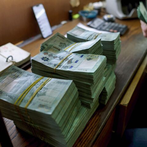 A clerk counts banknotes at a currency exchange office in Lebanon's capital Beirut, on January 20, 2023.