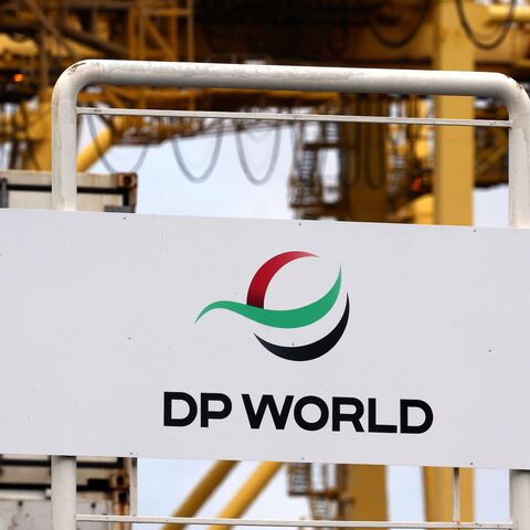 Gantry cranes are seen behind signage for ports operator DP World at an entrance to the Port Botany compound in Sydney on Nov. 13, 2023. 