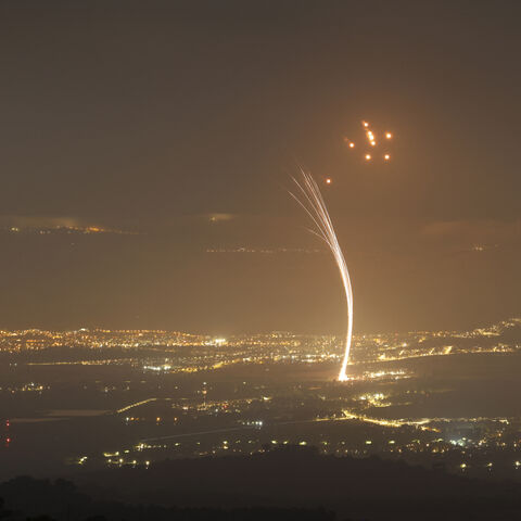 Rockets fired from southern Lebanon are intercepted by Israel's Iron Dome air defence system over the Upper Galilee region in northern Israel, on July 15, 2024, amid ongoing cross-border clashes between Israeli troops and Lebanon's Hezbollah fighters. (Photo by Jalaa MAREY / AFP) (Photo by JALAA MAREY/AFP via Getty Images)