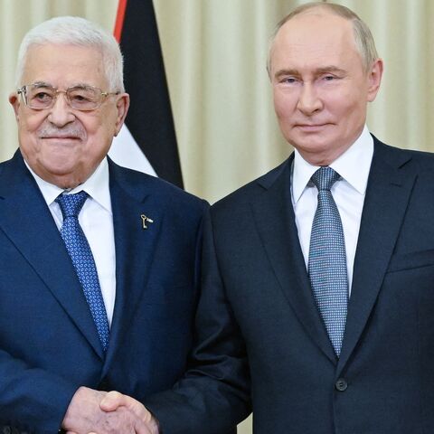 In this pool photograph distributed by Russian state owned Sputnik agency Russia's President Vladimir Putin (R) meets Palestinian Authority President Mahmud Abbas in Novo-Ogaryovo, outside Moscow on August 13, 2024. 