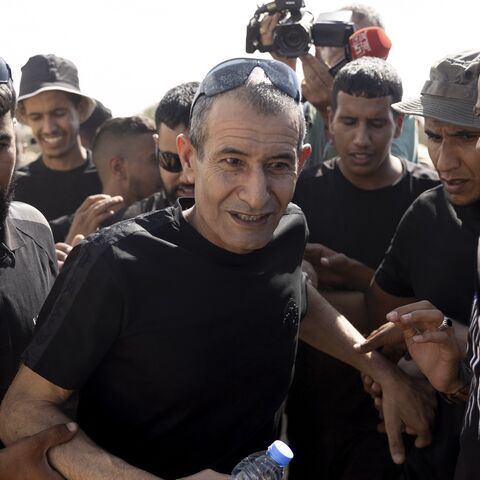 Qaid Farhan Alkaldi (C), who was held hostage by Hamas in Gaza, is greeted as he returns to the unrecognized Bedouin village of Carcur.