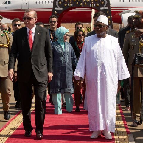 Malian President Ibrahim Boubacar Keita (R) welcomes Turkish president Recep Tayyip Erdogan (L) upon his arrival at Bamako airport on March 2, 2018.