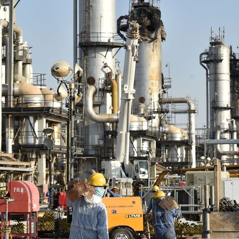 Employees of Aramco oil company work in Saudi Arabia's Abqaiq oil processing plant on September 20, 2019. 