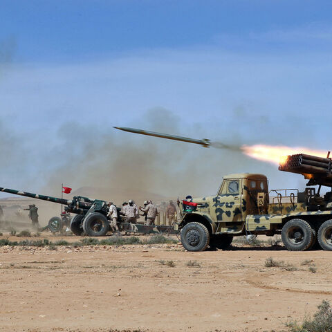 Members of the Libyan Army, under the command of the internationally recognized Government of National Unity, fire live ammunition during a drill in the western town of Tarhuna , on March 6, 2023. 