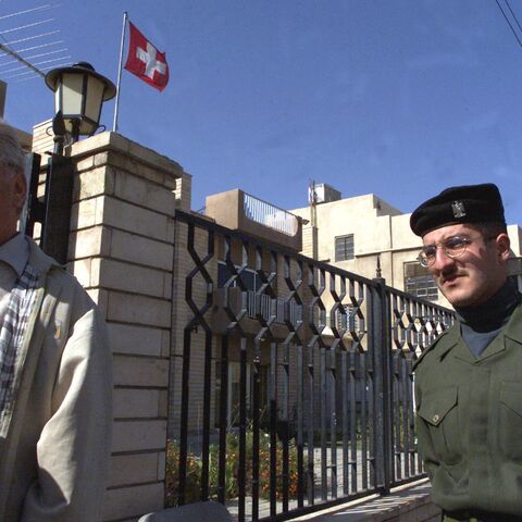 Kurt Reiniger, Swiss diplomat in charge of humanitarian affairs (L), arrives at the Swiss Embassy in Baghdad, on February 2, 2001. 