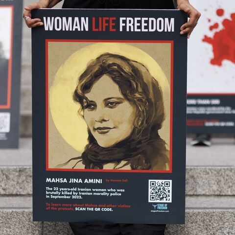 People take part in a protest in Trafalgar Square after marching through London ahead of the first anniversary of the death of Mahsa Amini, on September 13, 2023, in London, England.