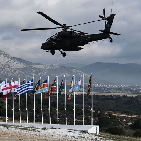 A Hellenic air force helicopter flies during the Olympic Cooperation 23 exercise at the Petrochori training area, near Xanthi, northern Greece, on Nov. 24, 2023.