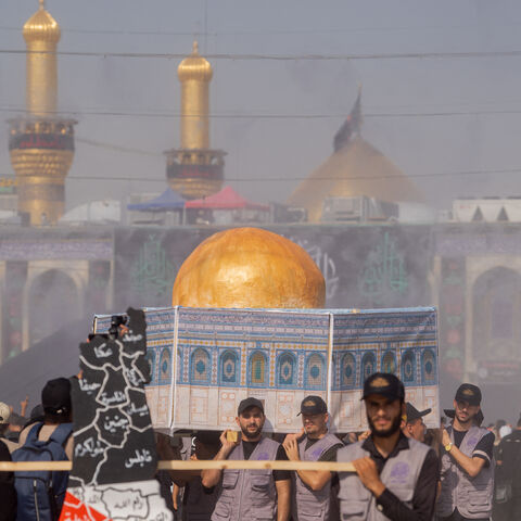 Shiite Muslim devotees attend mourning rituals in Iraq's central holy shrine city of Karbala on August 23, 2024 ahead of the Arbaeen commemorations that mark the end of the 40-day mourning period for the seventh century killing of the Prophet Mohamed's grandson Imam Hussein ibn Ali. (Photo by Ali Abdul Wahid / Middle East Images / Middle East Images via AFP) (Photo by ALI ABDUL WAHID/Middle East Images/AFP via Getty Images)