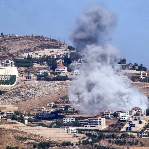 A cloud of smoke erupts during an Israeli airstrike on the village of Sujud in southern Lebanon on Sept. 25, 2024. 