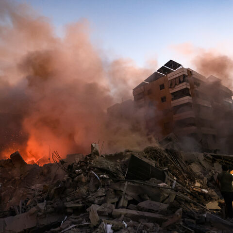 Smoke rises from the smouldering rubble at the scene of Israeli air strikes in the Haret Hreik neighbourhood of Beirut's southern suburbs on September 27, 2024. A source close to Hezbollah said the massive Israeli strikes on Beirut's southern suburbs flattened six buildings. (Photo by Ibrahim AMRO / AFP) (Photo by IBRAHIM AMRO/AFP via Getty Images)