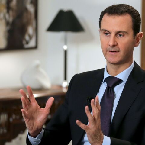 Syrian President Bashar al-Assad gestures during an exclusive interview with AFP in the capital, Damascus, on Feb. 11, 2016.