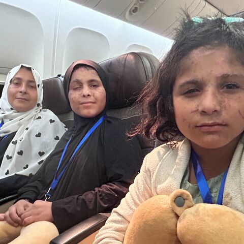 Mayssa (C), 15, and Yara (R), 10, from Khan Younis, on board the UAE evacuation flight that arrived from Eilat to Abu Dhabi on Sept. 9, 2025. 