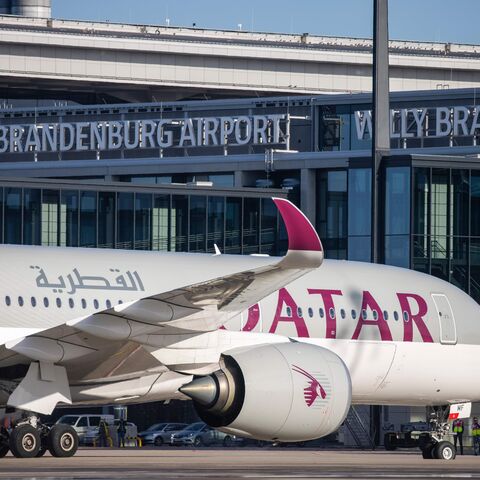 An Airbus A350 plane of Qatar Airways from Doha parks after it landed at Berlin's airport "Berlin Brandenburg Airport Willy Brandt", during the opening of the southern runway of the airport, in Schoenefeld, southeast of Berlin, on November 4, 2020. - Passenger flights are to began landing on October 31, 2020 at Berlin's new international airport, a moment many Germans thought they might never see after years of embarrassing delays and spiralling costs. (Photo by Odd ANDERSEN / AFP) (Photo by ODD ANDERSEN/AF