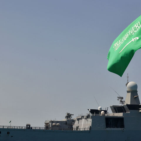 A Saudi navy ship is pictured docked at King Faisal navy base in Jeddah before the departure of a team to Port Sudan to help with the evacuation efforts of people fleeing Sudan, on April 29, 2023. - Warplanes on bombing raids drew heavy anti-aircraft fire over Khartoum as fierce fighting between Sudan's army and paramilitaries entered a third week, despite a renewed truce. (Photo by Fayez NURELDINE / AFP) (Photo by FAYEZ NURELDINE/AFP via Getty Images)