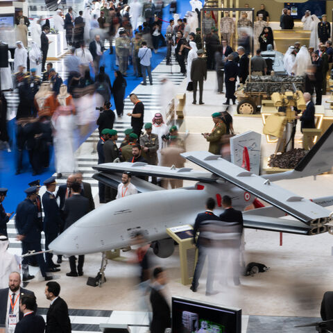 Visitors walk among displays at the UMEX Exhibition showcasing drones, robotics, and unmanned sytems at the Abu Dhabi National Exhibition Centre in Abu Dhabi on January 23, 2024. (Photo by Ryan LIM / AFP) (Photo by RYAN LIM/AFP via Getty Images)