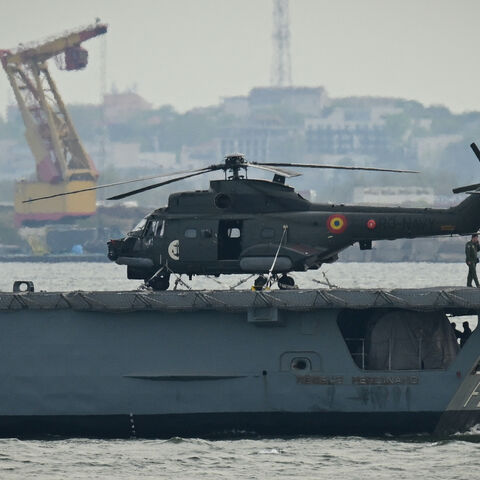 A Romanian Navy helicopter is pictured on the "King Ferdinand" frigate during "Sea Shield 24" exercise April 16, 2024. 