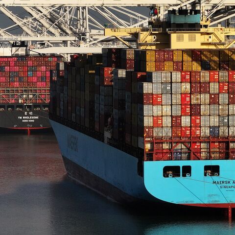 In an aerial view, container ships sit docked at the Port of Oakland on May 21, 2024, in Oakland, California. 