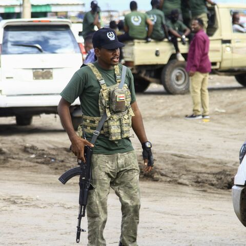 A member of a "joint security cell" made up of various military and security services affiliated with Sudan's army takes part in a parade in Gedaref in the east of the war-torn country, on July 28, 2024. 