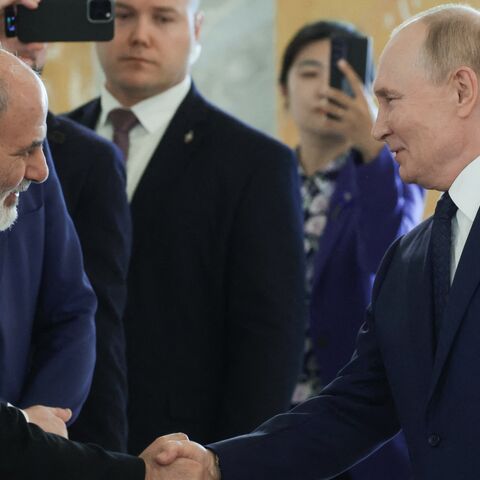 Russia's president, Vladimir Putin, shakes hands with Ali Akbar Ahmadian, secretary of Iran's Supreme National Security Council on Sept. 12, 2024. 