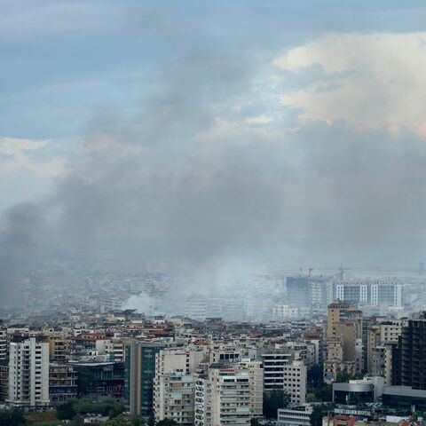 Smoke billows at the site of Israeli airstrikes in a south Beirut suburb, early on Oct. 2, 2024.