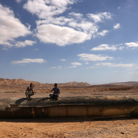 This picture shows the remains of an Iranian missile on the ground in the Negev desert near Arad, on October 2, 2024, in the aftermath of an Iranian missile attack on Israel. Israel vowed to make Iran "pay" for firing a barrage of missiles at its territory, with Tehran warning on October 2 it would launch an even bigger attack it is targeted. (Photo by Menahem KAHANA / AFP) (Photo by MENAHEM KAHANA/AFP via Getty Images)