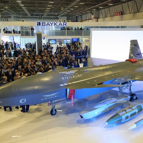 Visitors look at the Bayraktar Kizilelma UCAV during the opening day of SAHA EXPO 2024, an international defense and aerospace exhibition, Istanbul, Oct. 22, 2024.