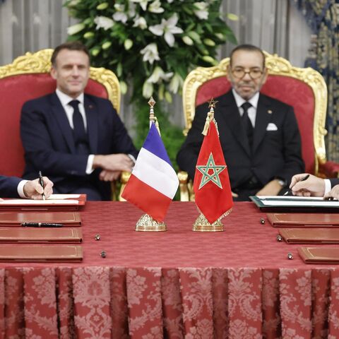 Morocco's King Mohammed VI (C-R) and France's President Emmanuel Macron (C-L).