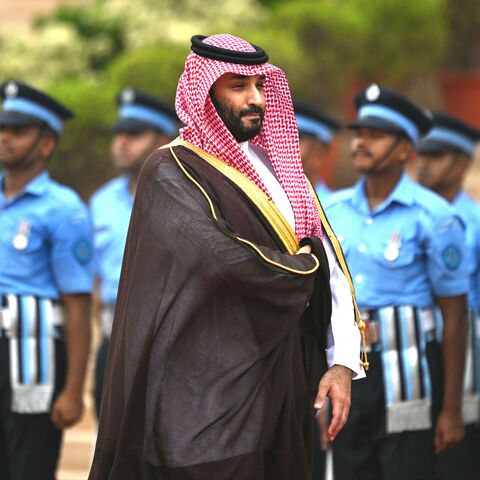 Saudi Arabia's Crown Prince and Prime Minister Mohammed bin Salman (C) inspects a guard of honour during a ceremonial reception at the President House a day after the G20 summit in New Delhi on September 11, 2023. (Photo by Money SHARMA / AFP) (Photo by MONEY SHARMA/AFP via Getty Images)