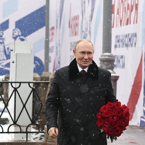 In this pool photograph distributed by Russian state agency Sputnik, Russia's President Vladimir Putin attends a flower-laying ceremony at the Monument to Minin and Pozharsky on Red Square on the National Unity Day in Moscow on November 4, 2024. (Photo by Mikhail TERESHCHENKO / POOL / AFP) (Photo by MIKHAIL TERESHCHENKO/POOL/AFP via Getty Images)