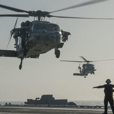 This US Navy photo released Jan. 15, 2015 shows an MH-60S Sea Hawk helicopter from the Red Lions of Helicopter Sea Combat Squadron (HSC) 15 as it prepares to land on the flight deck of the Nimitz-class aircraft carrier USS Carl Vinson (CVN 70) on Jan. 13, 2015 in the Gulf. 