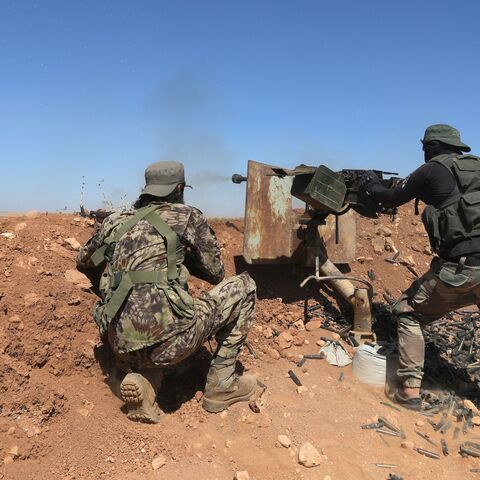 Fighters of Turkish-supported forces are positioned on the Buwayhij-Boughaz-Korhoyuk frontline on the outskirts of Manbij in northeastern Syria, as they fight with the Kurdish-led Syrian Democratic Forces (SDF) on Sept. 6, 2023. 