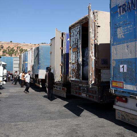 A convoy carrying humanitarian aid arrives in Syria after crossing the Bab al-Hawa border crossing with Turkey, on Sept. 19, 2023. 