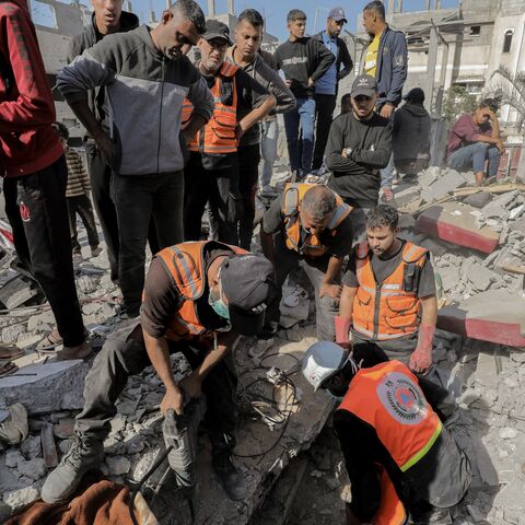 Rescue workers and civilians search through rubble in Gaza on Nov. 7, 2024, after an Israeli airstrike left devastation in a residential area. 