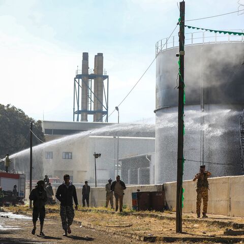 Yemeni firefighters douse oil tanks with water at a power station hit in an Israeli airstrike in the Houthi-run capital, Sanaa, Dec. 19, 2024.