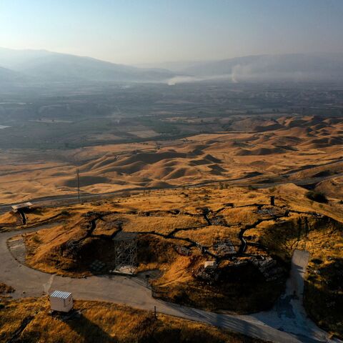 A picture taken on July 15, 2021, shows an abandoned Israeli army post in the Jordan Valley in the occupied West Bank near the border with Jordan (background). - As scientific warnings of dire climate change-induced drought grow, many in Israel and Jordan cast worried eyes at the river running between them and the critical but limited resources they share. (Photo by MENAHEM KAHANA / AFP) (Photo by MENAHEM KAHANA/AFP via Getty Images)