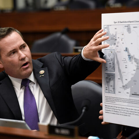 Rep. Michael Waltz (R-FL) displays a map with the 2021 bases/facilities with reported U.S. access agreements during a House Armed Services Committee hearing on the conclusion of military operations in Afghanistan at the Rayburn House Office building on Capitol Hill on September 29, 2021 in Washington, DC. The committee held the hearing “to receive testimony on the conclusion of military operations in Afghanistan and plans for future counterterrorism operations.” (Photo by Olivier Douliery-Pool/Getty Images)