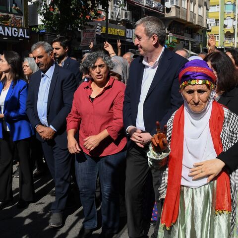 DEM Party co-chair Tuncer Bakirhan (C) walks with party members and attendees during a rally organized by the pro-Kurdish Equality and Democracy (DEM) Party