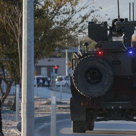 A Turkish Jandarma armored vehicle drives toward the entrance to the Turkish Aerospace Industries facility following an attack on Oct. 23, 2024 in Ankara, Turkey. 